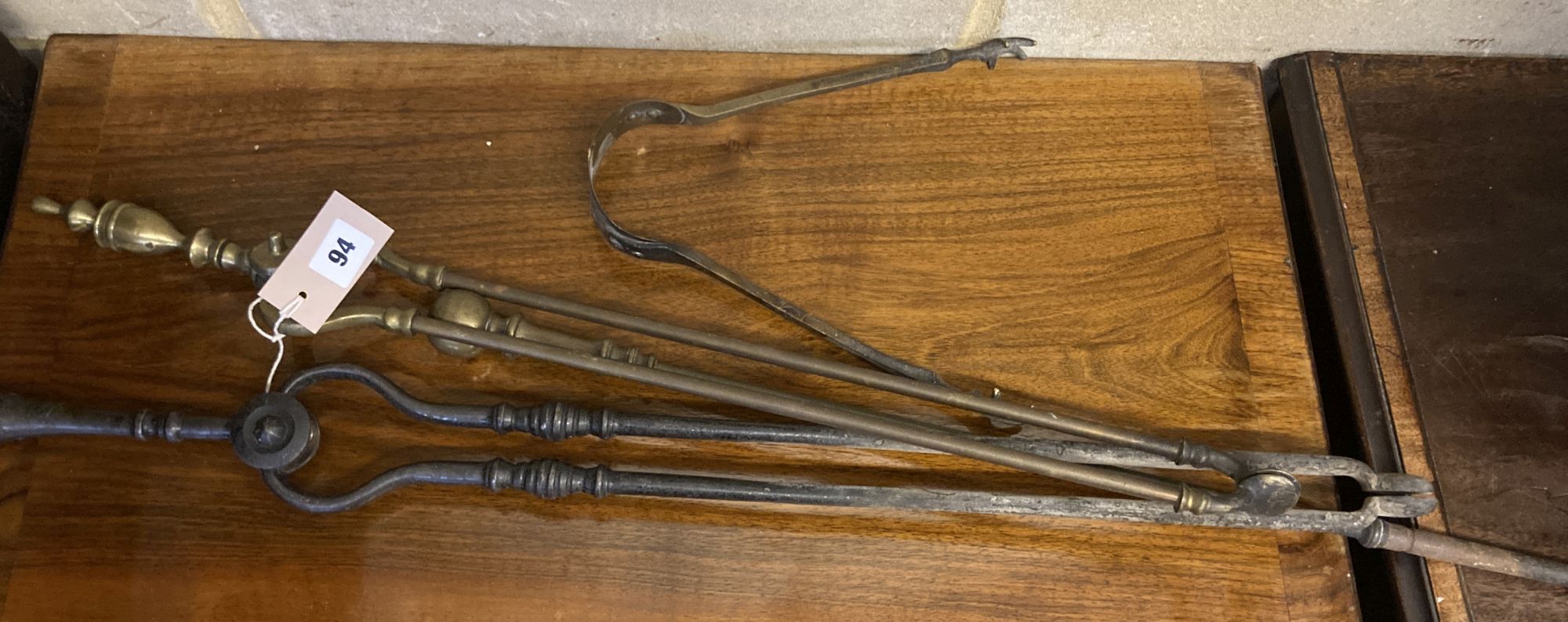 Four iron and brass fire implements